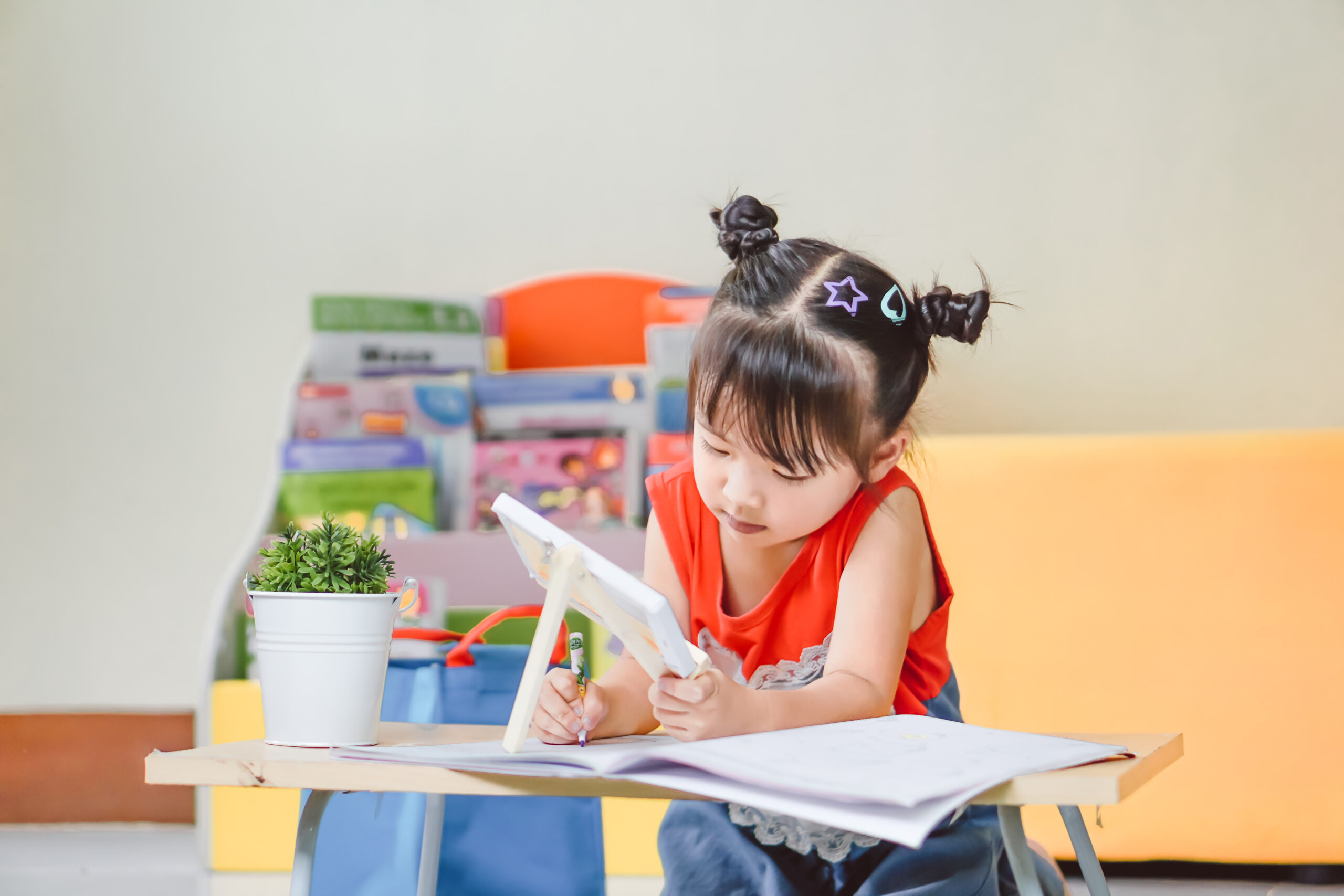 full length woman reading book while sitting table scaled
